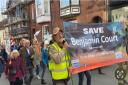 Members of the Save Benjamin Court campaign march in Cromer