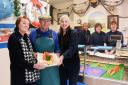 John and Claire Davies, with John's mum Julie, celebrating the 50th anniversary of Davies Fish Shop in Cromer. With them, back from left, are their staff, Louise Stokes, Rose Ely, and Chrissie Tanser