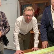 David Bill, right, with Holt mayor Rodney Smith and North Norfolk MP Duncan Baker looking at a model of the plans.