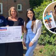 Rosie Johnson, specialist teenage cancer nurse at Addenbrooke's, accepts the cheque from Henry Hill's mum Lisa and sister Olivia last year. More fundraisers are planned in Henry's memory