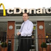 Kevin Foley outside his McDonald's drive-through restaurant near Norwich Airport in 2006