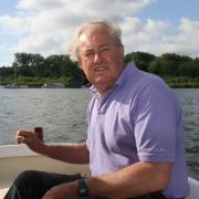 Kingsley Farrington helming the Jubilee Dinghy on Wroxham Broad in 2019. He will be remember like this as being at home on the water helming his own-built boats
