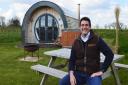 Luke Paterson of Dilham Hall with one of the glamping pods at Tonnage Bridge