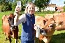Rebecca Mayhew with some of her dairy cows at Old Hall Farm in Woodton