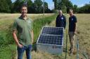 Jeremy Buxton (left) with his new solar-powered drinking water system at Eves Hill Farm near Reepham, along with Zac Battams (centre) and Ed Bramham-Jones from the Norfolk Rivers Trust