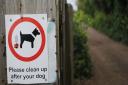 A sign asks dog owners to pick up after their pets. Picture: Chris Bishop