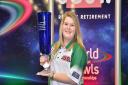 Katherine Rednall with her Just 2017 World Indoor Bowls Ladies Champion trophy. Picture:  Photowizards