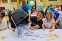 Vote counting takes place at St Andrew's Hall, Norwich after the ballot boxes arrived in a fleet of cars.PHOTO BY SIMON FINLAY
