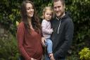 Lauren Driver is pictured with her partner Mat Young and daughter Isabella. Picture: Matthew Usher.