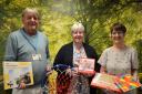 North Walsham hospital Friends chairman Keith Jarvis and treasurer Carol Willgress, right, present the activities to hospital inpatient administrator Wendy Russell