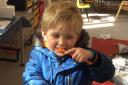 A youngster brushes his teeth at Worstead Preschool