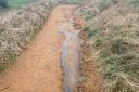 Norfolk County Council has blamed the materials used to resurface a coastal path as the reason it has lasted less than two years