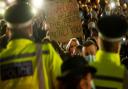 Police front up to demonstrators at a vigil for Sarah Everard in London