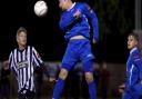 Danny Beaumont heads the ball for Wroxham during a match against Wroxham. Picture: MARK BULLIMORE