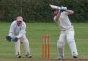 North Elmham'’s James Dagless patiently grafting for his runs in the gathering gloom. Picture: MIKE WYATT