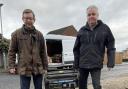 Duncan Baker, MP for North Norfolk, and Rob Scammell holding a power generator that will be delivered to Ukraine in February.