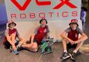 At the robotics championships in Dallas, Texas, were, from left, Noah Heath, William Cokayne and Leo Malakar.