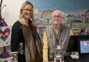 Shop manager Naomi Munro with volunteer and autograph hunter Andrew Stewart Picture: EACH