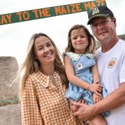 Victoria and Henry Cushing with daughter Matilda at the new maize maze at The Pumpkin House.