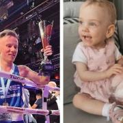Troy Tobias, 28, celebrates after winning a boxing fight he had dedicated to his daughter Isla who survived a major operation when she was three weeks old.