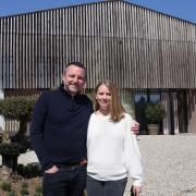 Luke and Klara Hawes outside their 'grain store' home which they have converted into luxury on a futuristic design.