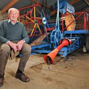 Billy Hammond, a former president of Holt Farmers' Club and the Aylsham Show, has died aged 94. He is pictured with his rare Ransomes combine harvester