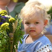 Zlata with the bouquet of flowers her elder sister made for her