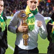 Liam Walsh, middle, and his brothers Ryan, left, and Michael at Carrow Road - but will they be back soon? Picture: PAUL CHESTERTON