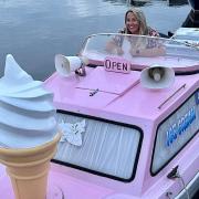 New owner Pam Robinson in The Ice Float boat on the Norfolk Broads.