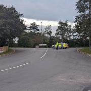 A road has been closed by police in North Walsham following an incident