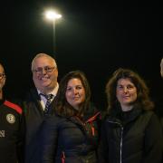 At Sheringham Football Club's grounds under one of the new floodlights are, from left, Paul Middleton, Charles Sanders, Trish McLaren, Sharon Hammond and Clive Hay-Smith of Hollands Sheringham Ltd.