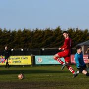 Jamie Smith opening the scoring for Sheringham FC in their clash against the UEA in Dereham.