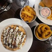The chicken shawarma, sides and sea bass burger at Yellows Bar and Grill in Norwich.