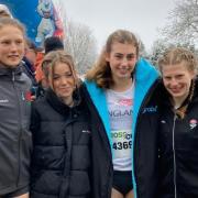 Hattie Reynolds, third from left, pictured with other runners, made her international debut in Belgium.