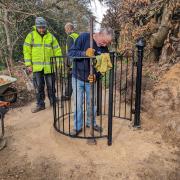 The refurbished kissing gate being installed in Love Lane, Cromer - Picture: Supplied by Tim Adams