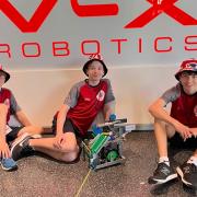 At the robotics championships in Dallas, Texas, were, from left, Noah Heath, William Cokayne and Leo Malakar.