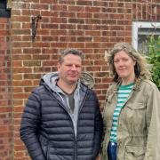 Alan and Sara Caistor outside their rented Holt home