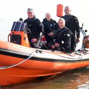 Paul Hennessey, right, of Anglian Divers Club and Norfolk Wreck Research, with club members, from left, Tony Holmes, Roger Smith, and Rob Wade ready to set out from Sea Palling to a wreck site