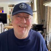 Stephen Fry wears a Sheringham Shantymen baseball cap in a video recorded for the band's annual charity gig