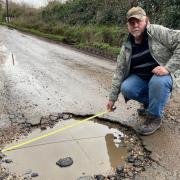 Angry villagers in Dilham want the council to pay for the damage potholes have caused to their vehicles - which could cost Roy Jones £2,000 for a new set of tyres