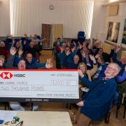 Cromer Peregrine Project chairman Eddie Anderson presents a cheque worth £2,000 from the group to Cromer's Parish Church