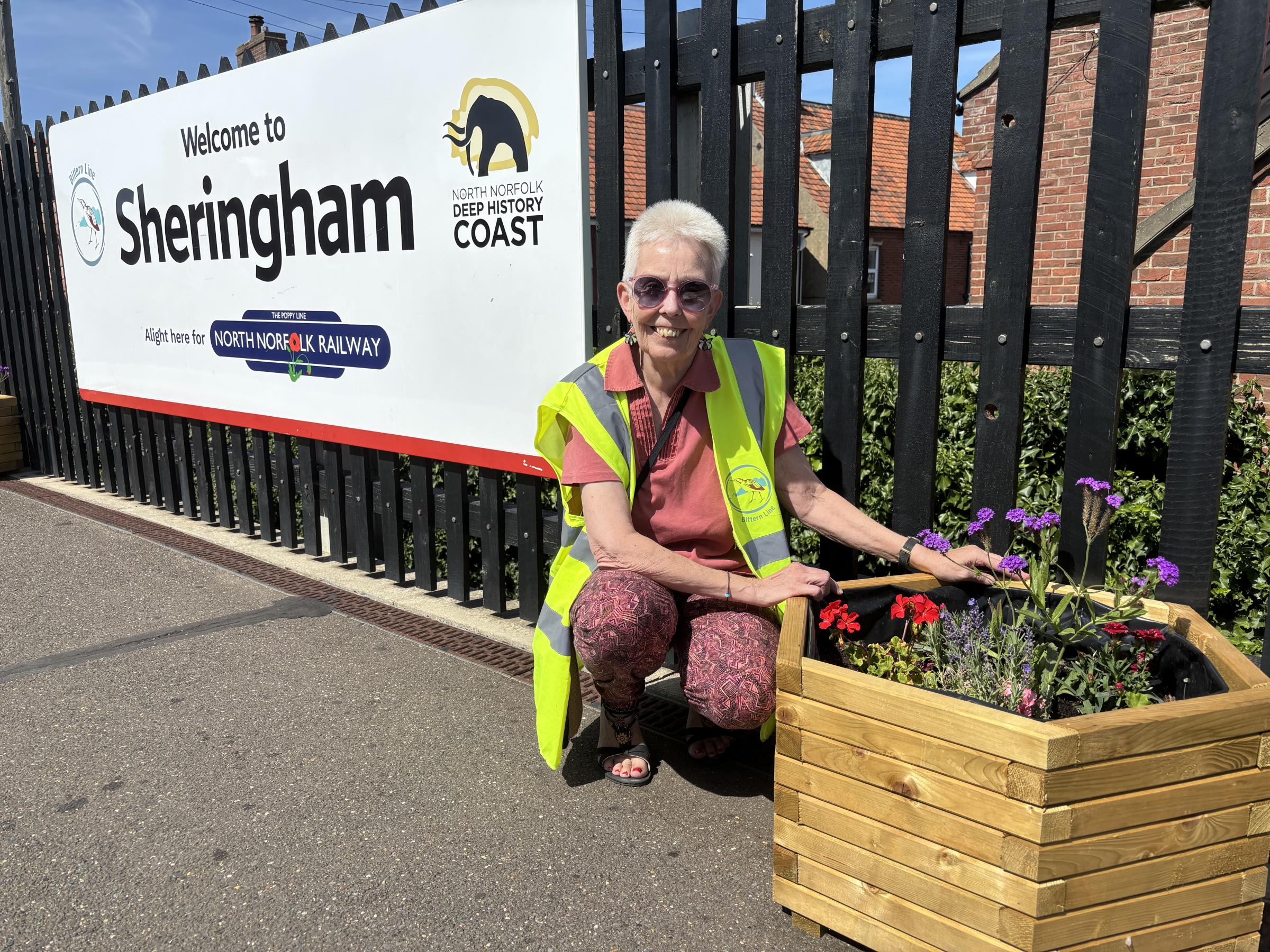 Volunteers brighten railway station with new planters
